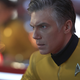 Pretty sure that, at least in this picture, the glow in the background is just from Enterprise’s retro console buttons and not the sparks of an explosion.